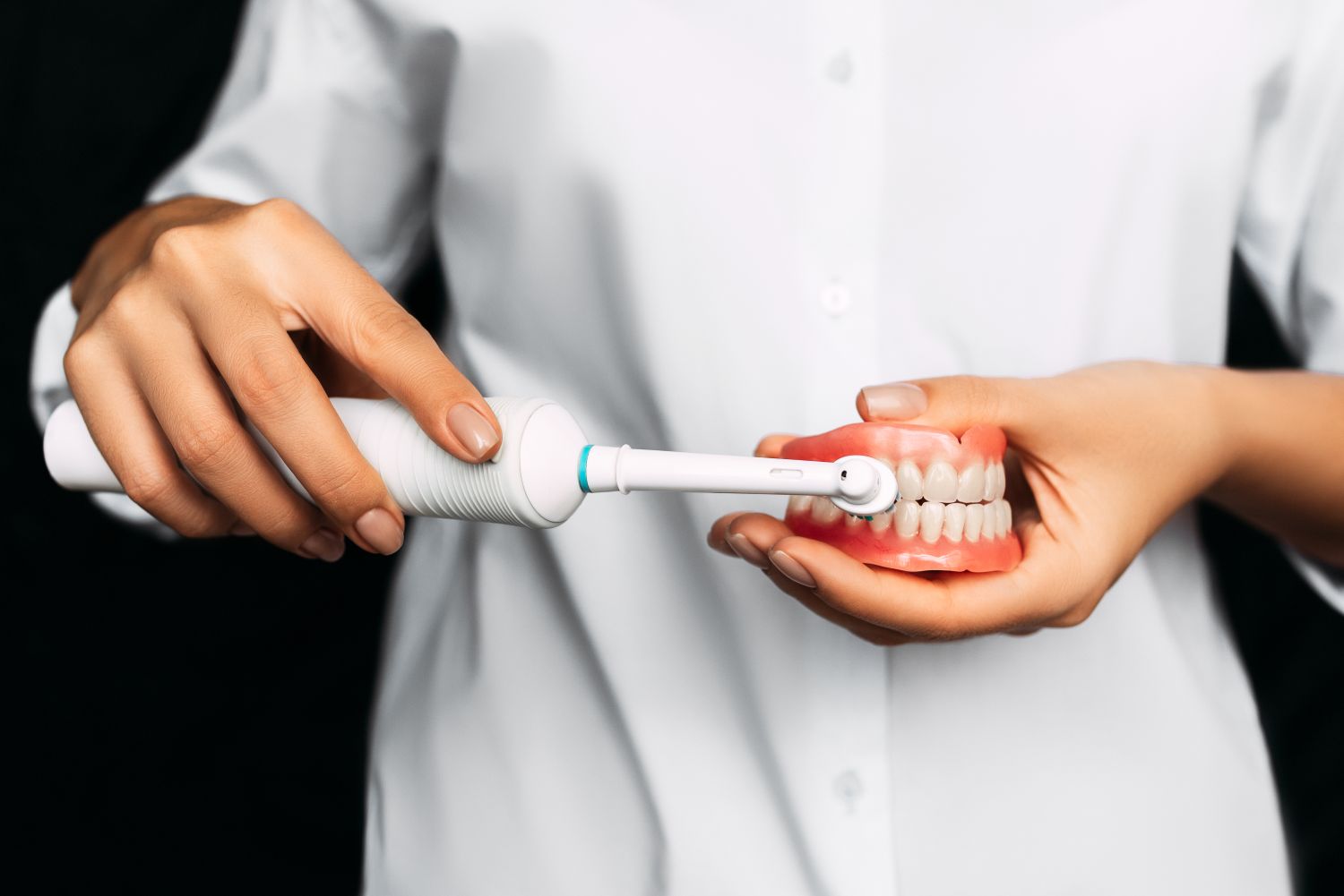 Brushing fake teeth